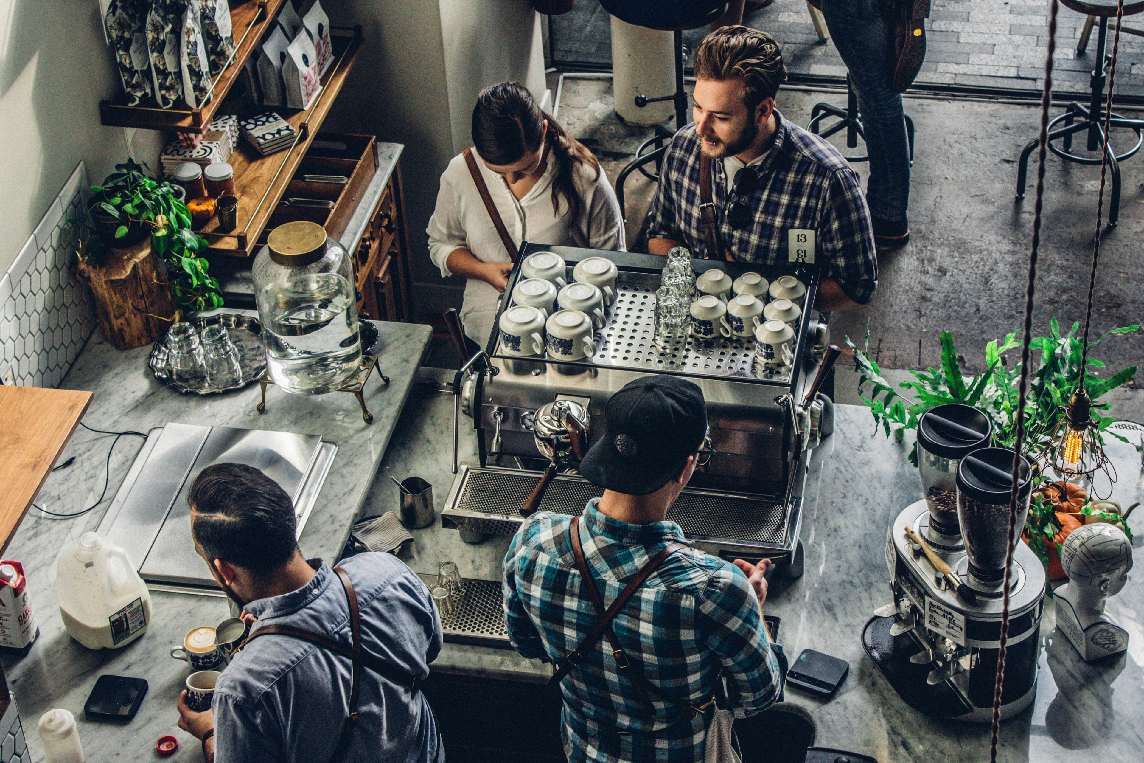 Customer buying coffee at a café counter