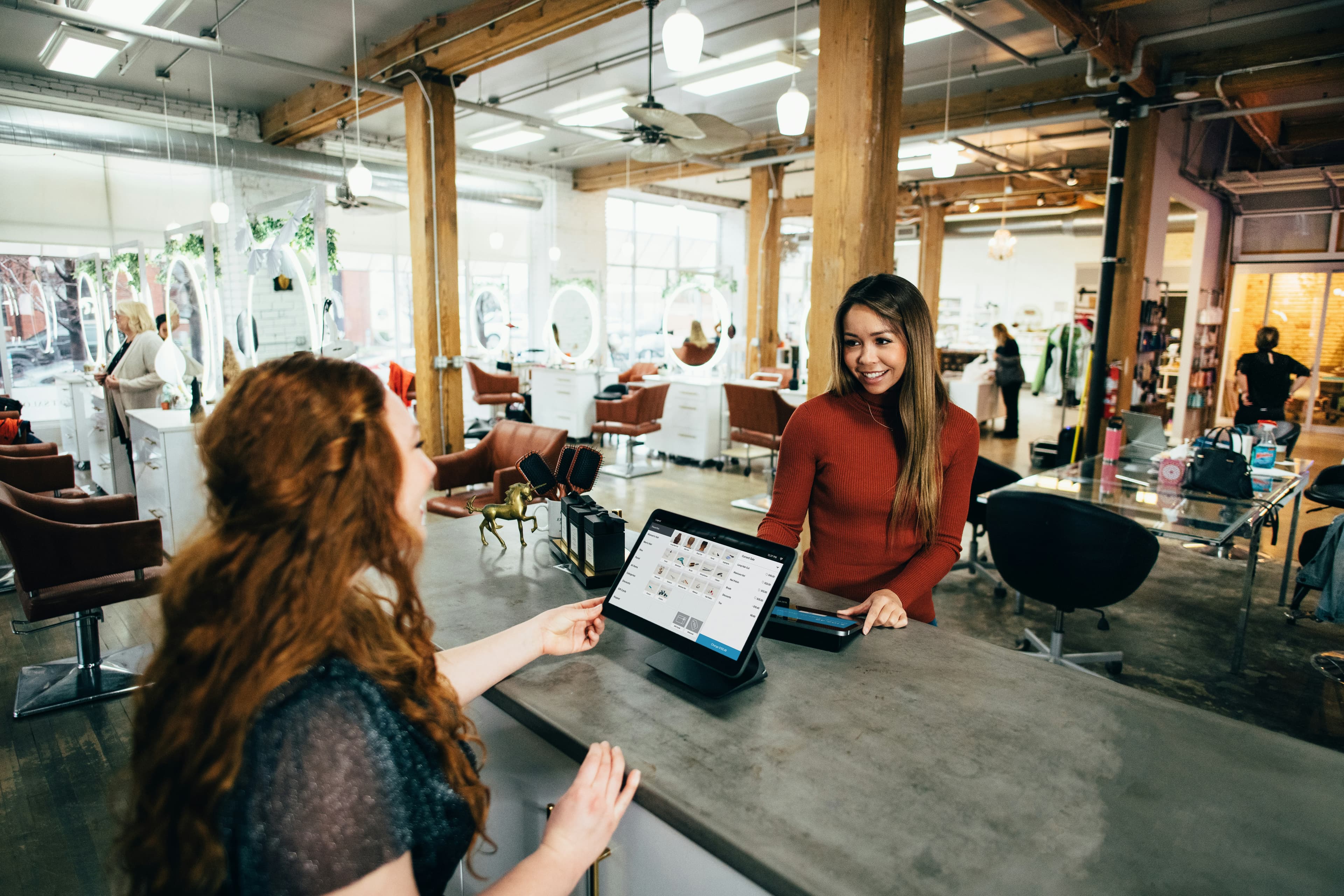 Two women at a small business counter